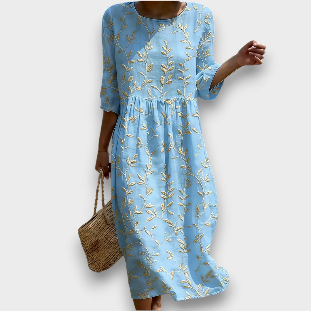Sira | Vestido midi con escote redondo y estampado de plantas y flores